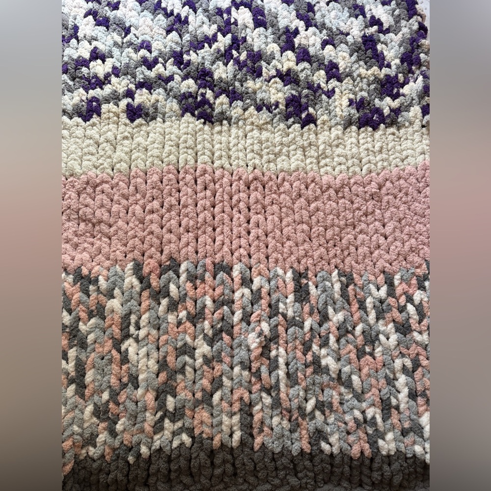 Multi colored (pink, grey, purple, blue, white) about 6 1/2’ x 4’ knit blanket